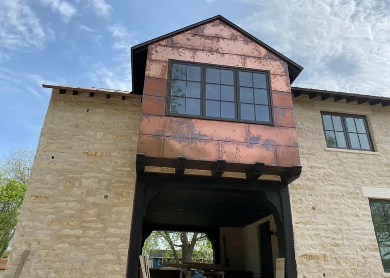 Copper metal panel facade on a stone building for Skylight Installation in Scotch Plains