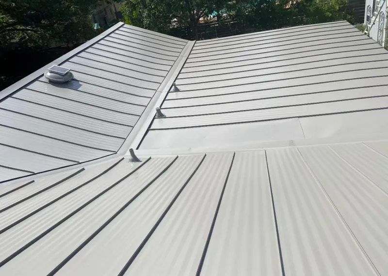 Solar attic fan installed on a metal roof for Roof Ventilation in Scotch Plains
